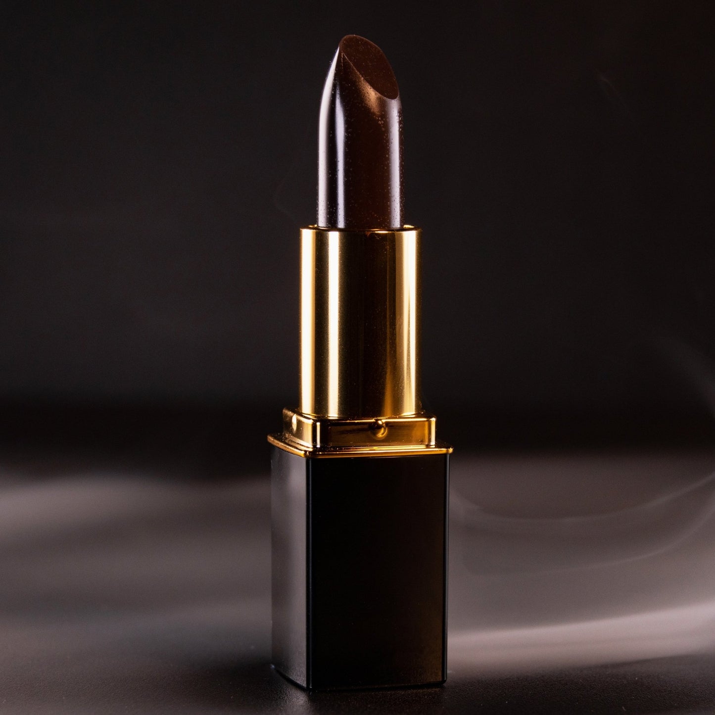 Close-up of black lipstick bullet in gold L’Paige casing