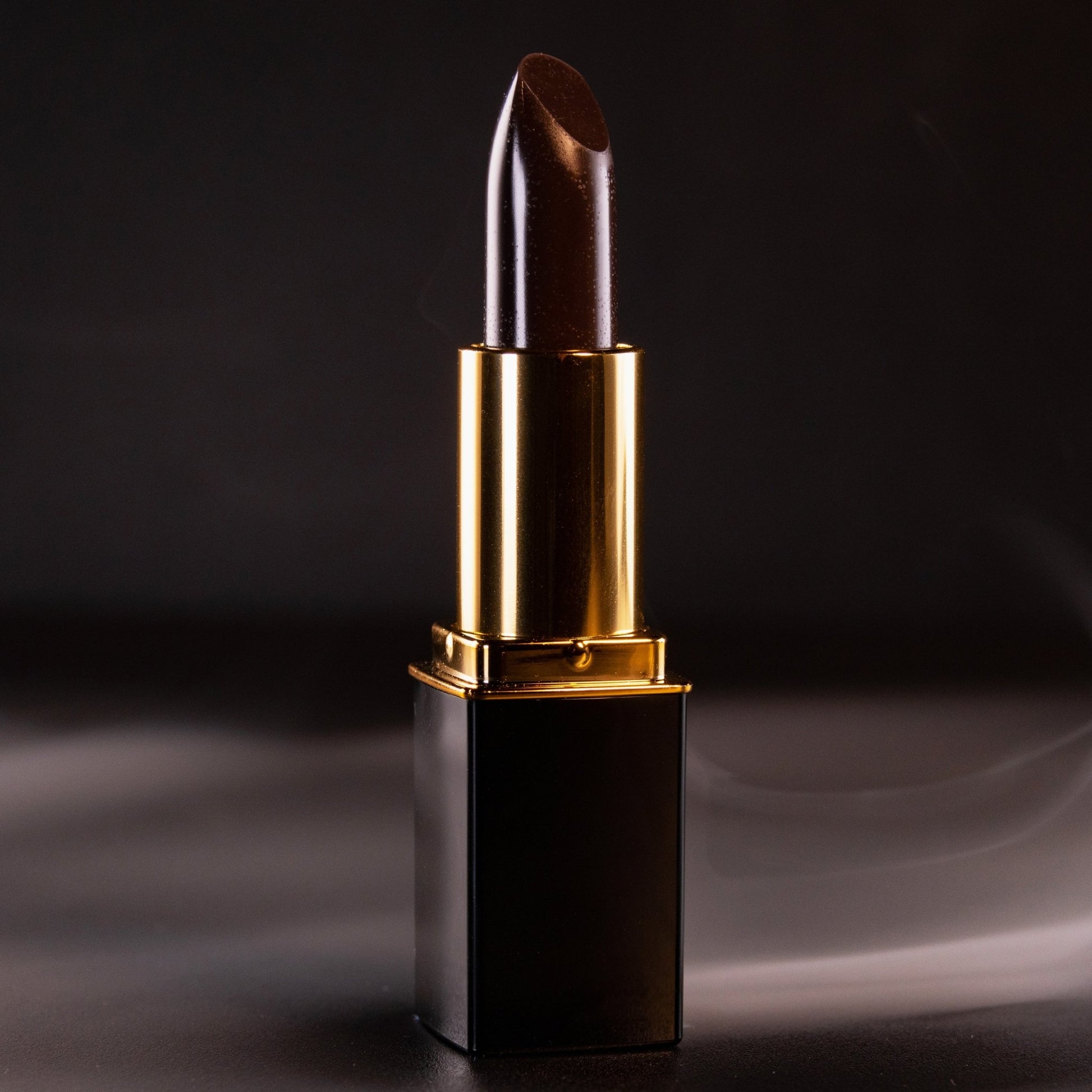 Close-up of black lipstick bullet in gold L’Paige casing