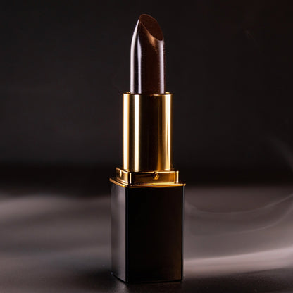 Close-up of black lipstick bullet in gold L’Paige casing
