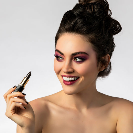 Model wearing L’Paige black color-changing lipstick with custom berry-pink finish