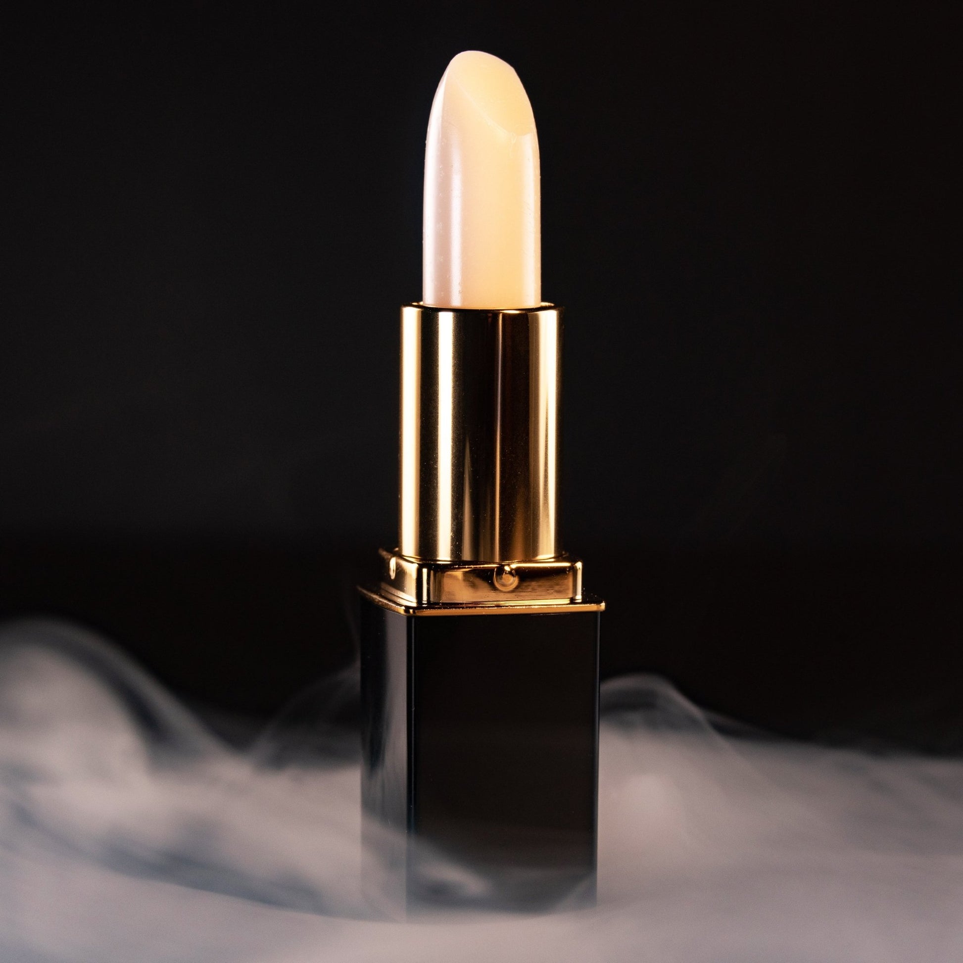 Close-up of white lipstick bullet in gold L’Paige casing