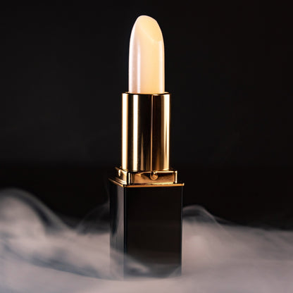 Close-up of white lipstick bullet in gold L’Paige casing