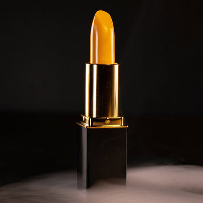 Close-up of yellow lipstick bullet in gold L’Paige casing